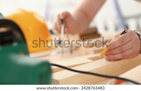 Arms of worker making structure plan on scaled paper closeup. Manual job DIY inspiration improvement job fix shop graphic joinery startup workplace idea designer career wooden bar ruler