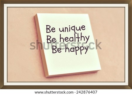Text be unique be healthy be happy on the short note texture background