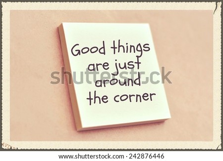 Text good things are just around the corner on the short note texture background