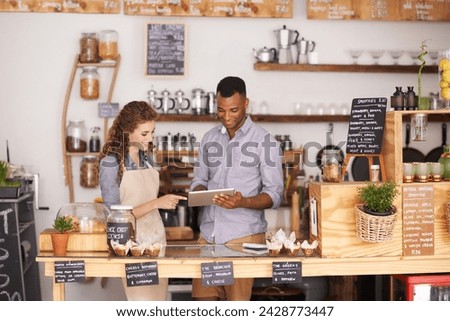 Collaboration, small business shop and tablet with owner in coffee shop together for planning or service. Teamwork, technology for ecommerce or online order with man and woman in cafe or restaurant Royalty-Free Stock Photo #2428773447