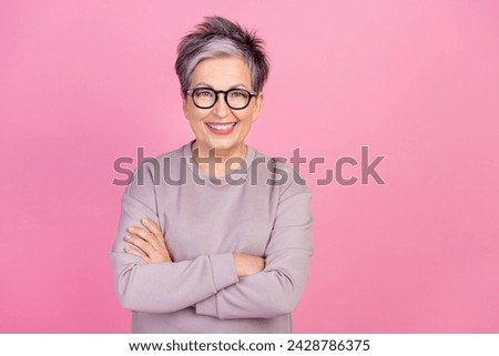 Portrait photo of expert confident smiling business couch mature age woman wear sweatshirt crossed hands isolated on pink color background Royalty-Free Stock Photo #2428786375