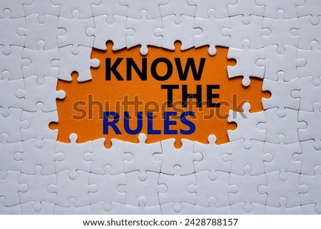 Know the rules symbol. Concept words Know the rules on white puzzle. Beautiful orange background. Business and Know the rules concept. Copy space.