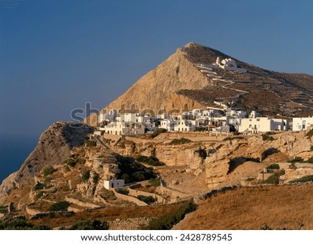 Terraces, the chora village and zigzag path up to church on hillside on folegandros, cyclades, greek islands, greece, europe