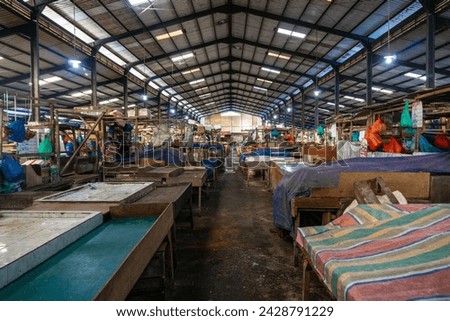 Batu 9 Fish Market, also known as Pasar Bintan Center. In one of the most famous fish markets in Tanjungpinang, the fish boxes are neatly organized and labeled with letters to prevent mix-ups
