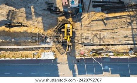 Hydraulic Drilling Rig. Foundation Ground. Installation of bored Piles By Drilling. Hydraulic pile drilling machine worker digging at industrial construction site.