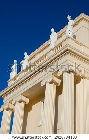 Pillars and statues on cream coloured john nash designed building, cumberland house, near regent's park, london, england, united kingdom, europe