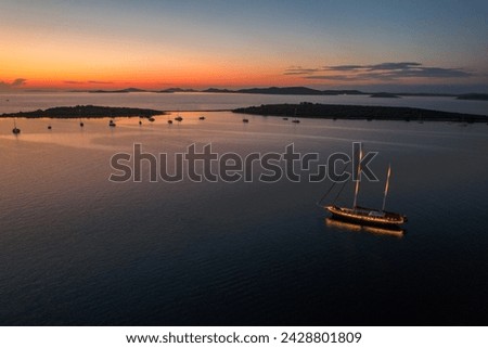 Beautiful sunset on croatian bay with sailboats