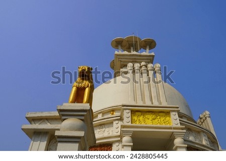 golden lion in dhauli shanti stupa Royalty-Free Stock Photo #2428805445