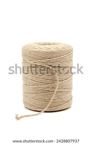 A spool of natural cotton twine with a wide range of applications. Selective focus with shallow depth of field.