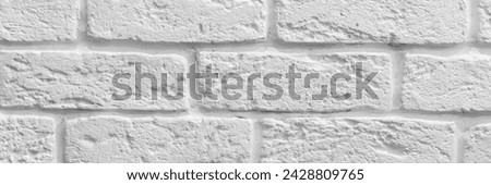 Decorative rough white brick wall background texture banner. Panoramic web header. Wide screen wallpaper.