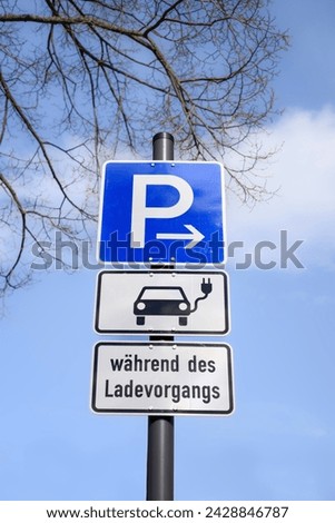 Parking sign in Germany,   Text: whilst loading your electric vehicle
