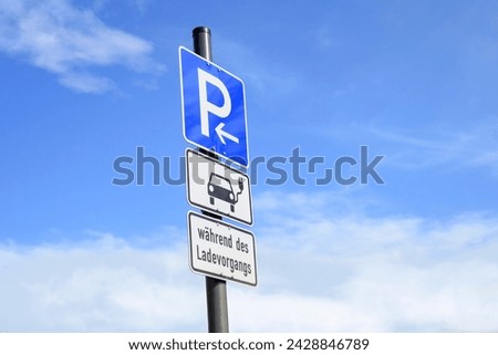 Parking sign in Germany,   Text: whilst loading your electric vehicle