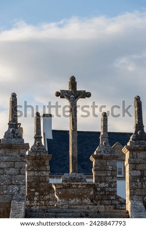 cross on a cemetery in the evening