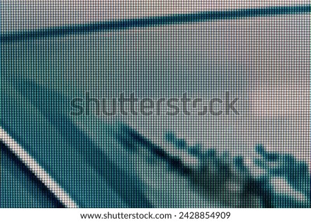 A magnified look at the pixels of an LCD screen, dark green grey white black creepy scary unnerving digital tech background monitor display texture macro detail front view, extreme closeup, nobody Royalty-Free Stock Photo #2428854909