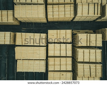 This is an aerial photo of some lumber near a lumber yard. 