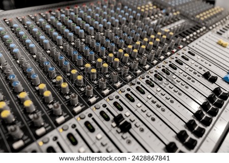 Mixer control. Music engineer. Backstage controls on an audio mixer, Sound mixer. Professional audio mixing console with lights, buttons, faders and sliders. sound check for concert. Royalty-Free Stock Photo #2428867841