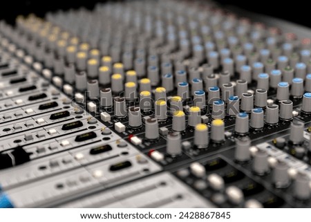 Mixer control. Music engineer. Backstage controls on an audio mixer, Sound mixer. Professional audio mixing console with lights, buttons, faders and sliders. sound check for concert. Royalty-Free Stock Photo #2428867845