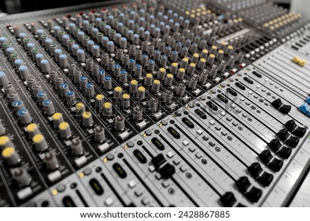 Mixer control. Music engineer. Backstage controls on an audio mixer, Sound mixer. Professional audio mixing console with lights, buttons, faders and sliders. sound check for concert. Royalty-Free Stock Photo #2428867885
