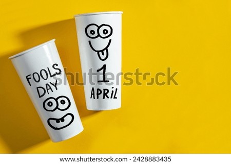 April Fools' Day celebrated on April 1 concept, background with Paper cup for prank.