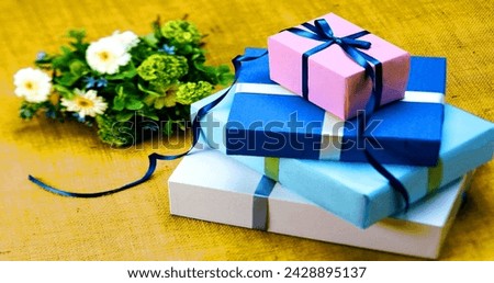 Birthday Images, Backgrounds, and Wallpapers.A celebration of joy with beautifully wrapped Gifts, Stacked Boxes, and charming Ribbon bows of happiness and surprise.