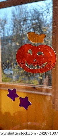 Pumpkin Halloween decor on the window for a festive atmosphere.