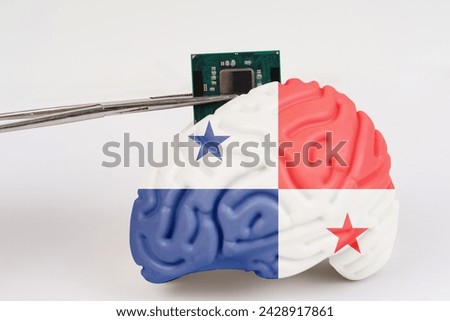On a white background, a model of the brain with a picture of a flag - Panama, a microcircuit, a processor, is implanted into it. Close-up