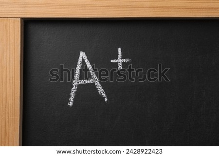 School grade. Letter A with plus symbol on blackboard, top view