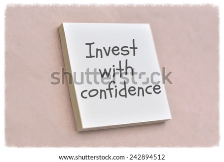 Text invest with confidence on the short note texture background