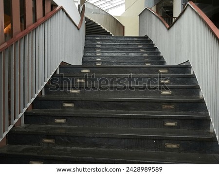 Outdoor stair with white fences at the side