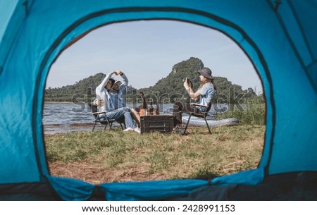 Happy family is camping trip on summer holiday take photo camera is summer holiday camping activity.