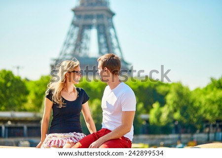 Young couple with the Eiffel tower in the background 