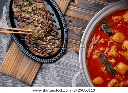 Grilled short rib patties and braised spicy chicken Royalty-Free Stock Photo #2429000113