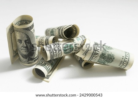 a role-dollar bills in front of white background
