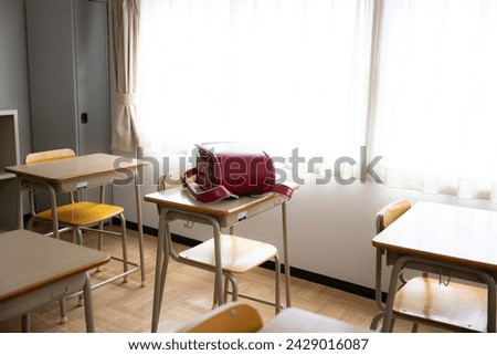 A school bag on a desk in a classroom at a Japanese elementary school during the daytime. Royalty-Free Stock Photo #2429016087