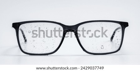 Eyeglass lenses with water droplets