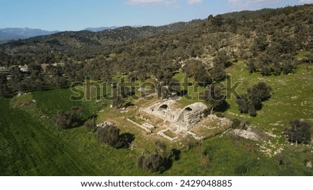 Aerial view of the ruins of the ancient city of Euromos, built on the slope of the hill. Kizilcakuyu Milas Mugla Turkey Royalty-Free Stock Photo #2429048885