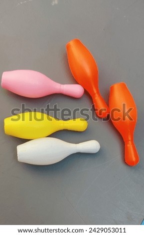 Adorable plastic blowling pins for kids isolated.