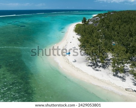 Aerial picture: Beach line, kitesurfing, ocean and palms, Mauritius island