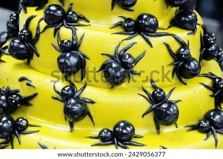 halloween cake concept, black spiders on yellow cake