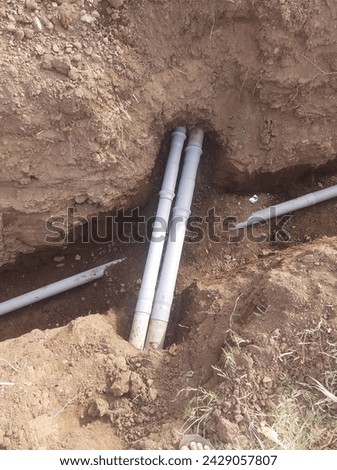 Siphon pipe laying in farm land