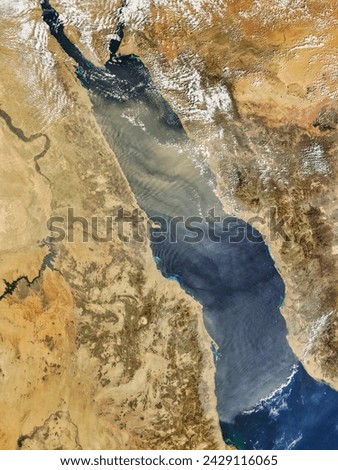 Dust over the Red Sea. A ribbon of dust hangs over the Red Sea in this photolike satellite image from February 26, 2010. Elements of this image furnished by NASA.