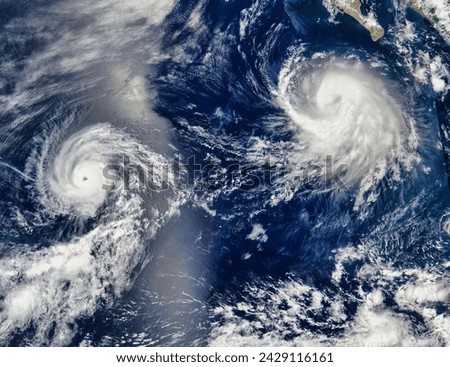 Tropical Storm Frank 07E and Hurricane Georgette 08E in the eastern Pacific Ocean. Tropical Storm Frank 07E and Hurricane Georgette 08E. Elements of this image furnished by NASA.