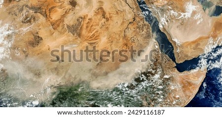 Dust storms across central Africa and the Arabian Peninsula. Dust storms across central Africa and the Arabian Peninsula. Elements of this image furnished by NASA. Royalty-Free Stock Photo #2429116187