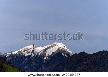 Scenic view of mountain panorama with snow covered Pilatus mountain in the Swiss Alps on a winter morning. Photo taken February 21st, 2024, Canton Nidwalden, Switzerland.