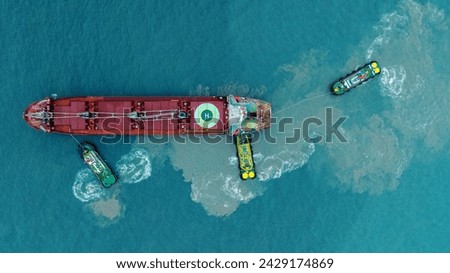 Tug boat pulling cargo container ship to dry dock concept maintenance service working in the sea. Insurance and Maintenance Cargo Ship concept. Freight Forwarding Service maintenance Insurance