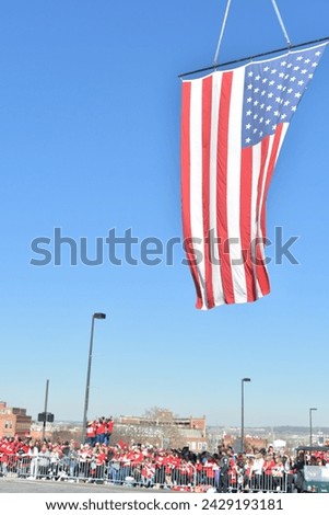 American flag over a city street