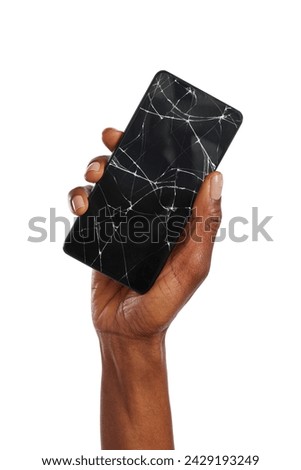 Close up of black woman hand holding broken smartphone against white background. African american woman hand holding cellphone with broken screen. Broken screen glass of a modern phone, need repair.