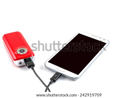 Recharging smart phone tablet from power bank, electricity's source portable on withe background.