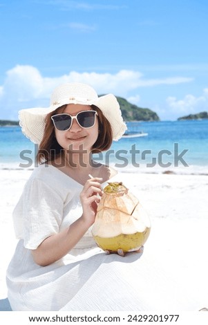 a girl enjoying a holiday on the beautiful Lombok beach with a tropical climate, travel concept
