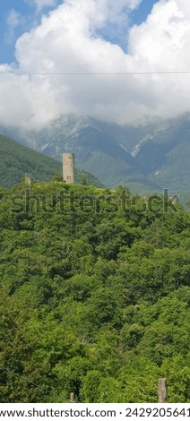 A picture of a small castle between the mountains of Comano in the city of Carrara, Italy.in 20.7.2023